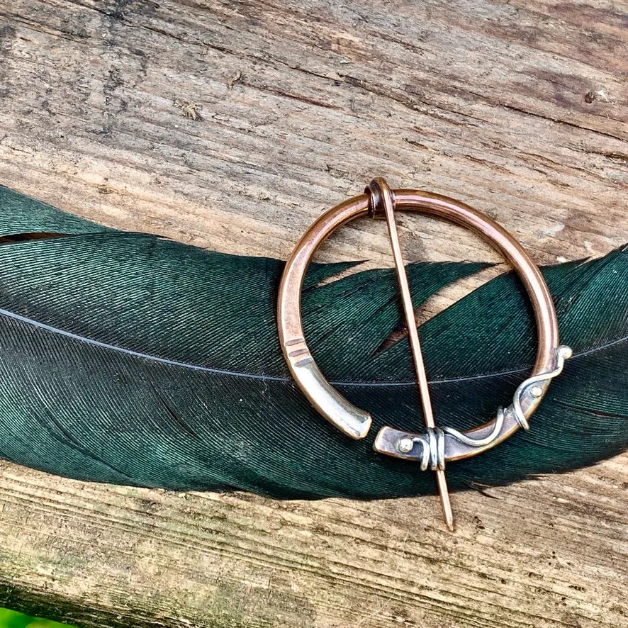 Copper and Sterling silver Pen-annular brooch.