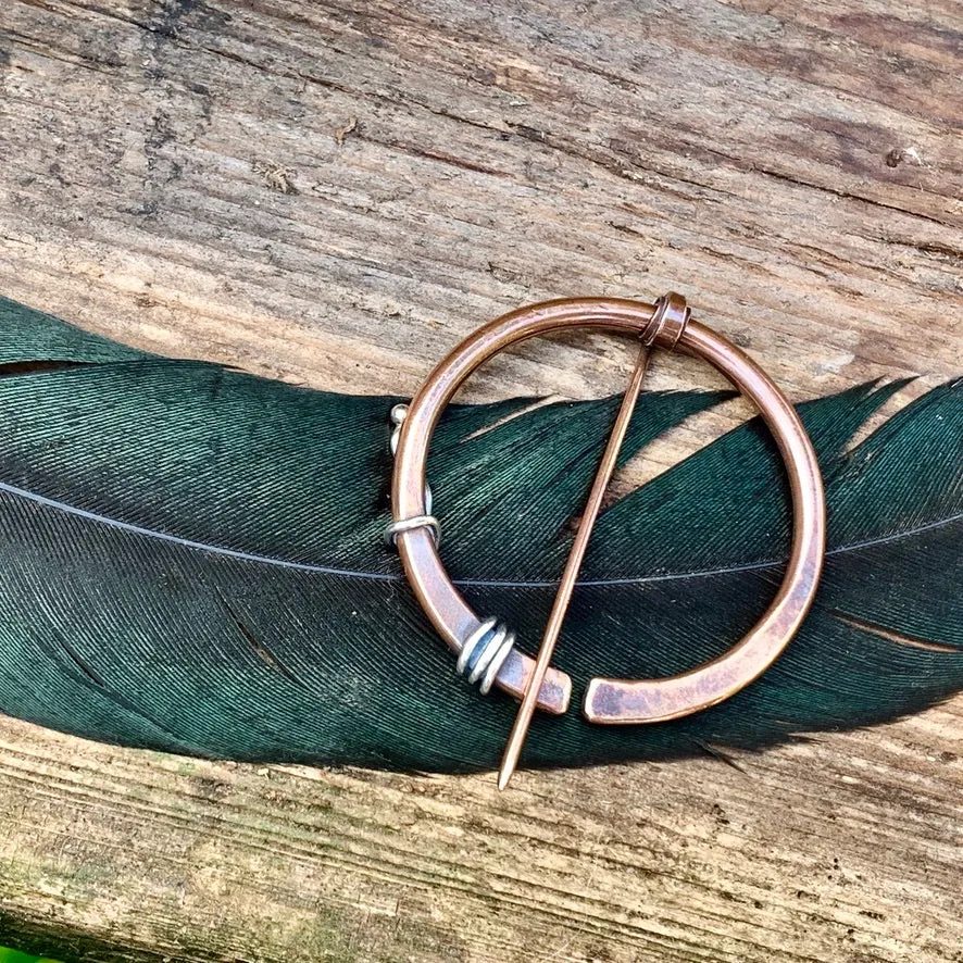 Copper and Sterling silver Pen-annular brooch.