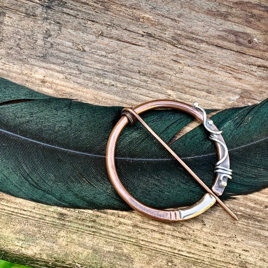 Copper and Sterling silver Pen-annular brooch.