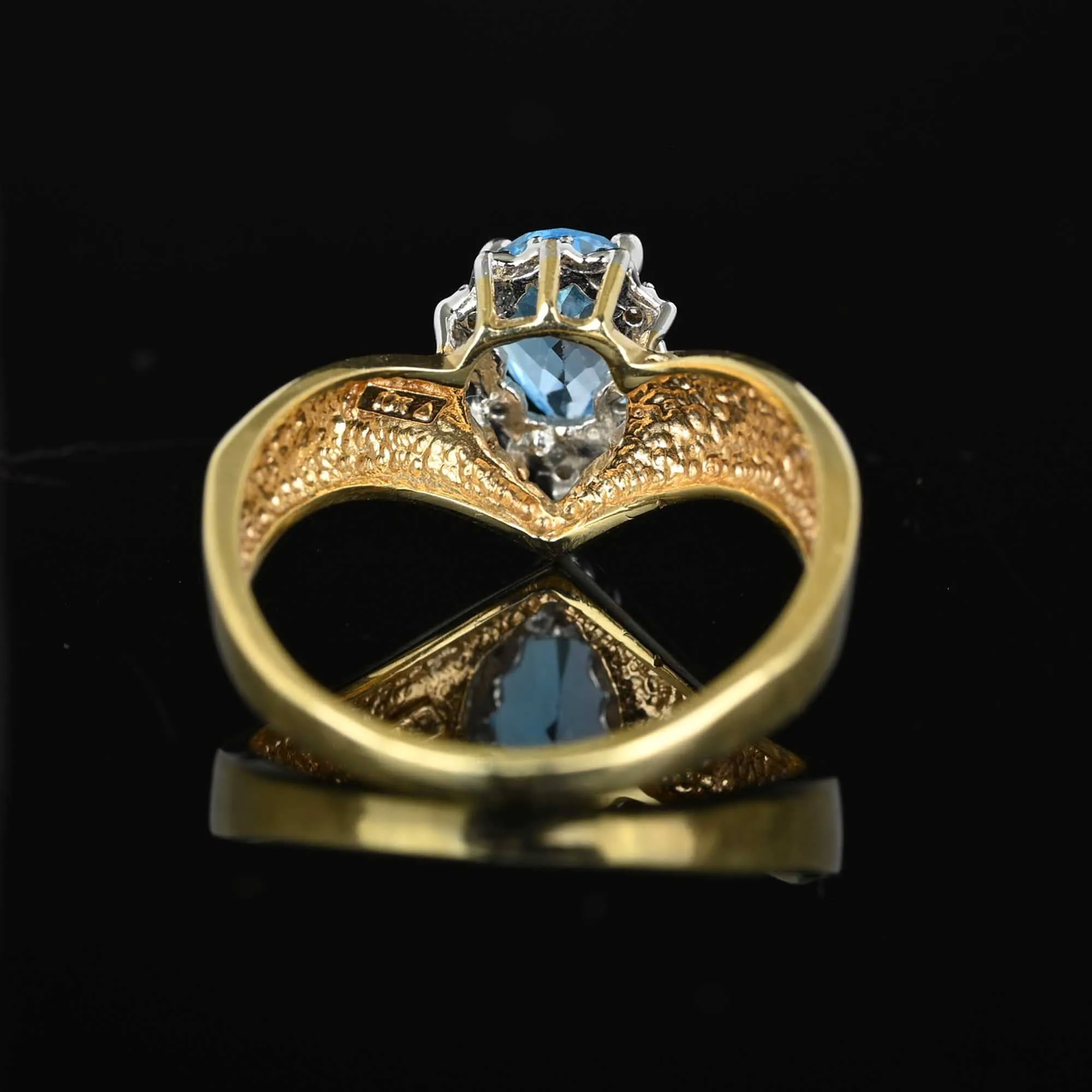 Diamond Halo Pear Cut Blue Topaz Ring in Gold